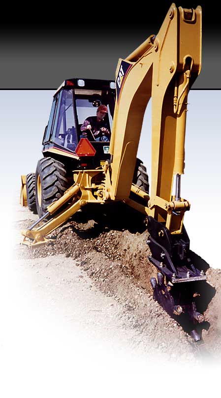 Backhoe with Barone Care-Free Compaction wheel attachment compacting dirt and soil in trench after excavation and installation of utilities.